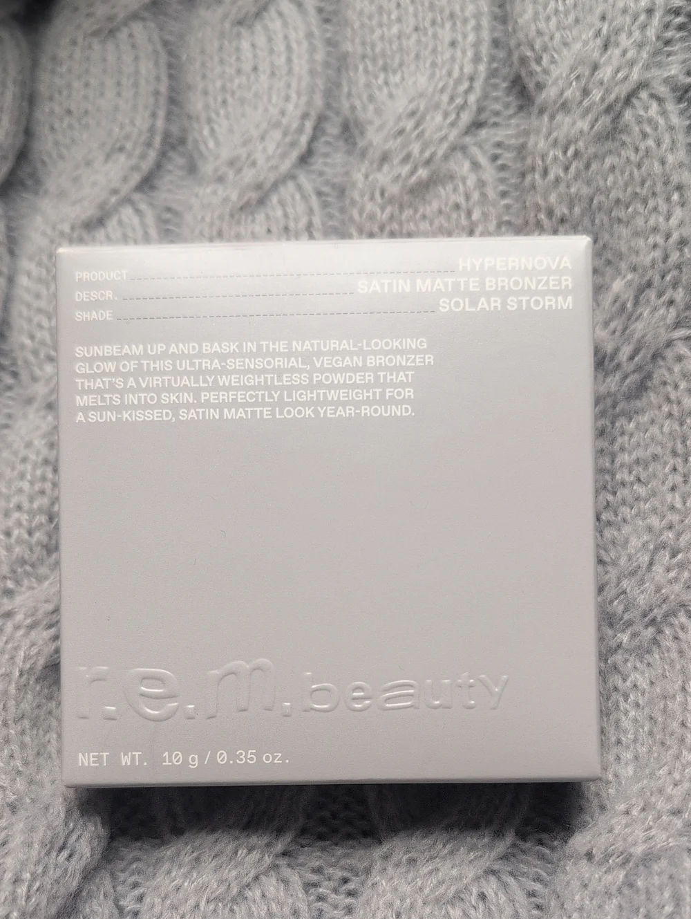 r.e.m. beauty Satin Matte Bronzer - Solar Storm (Gray)